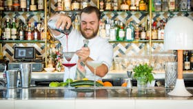 Bartender creating a cocktail at Henry Deane