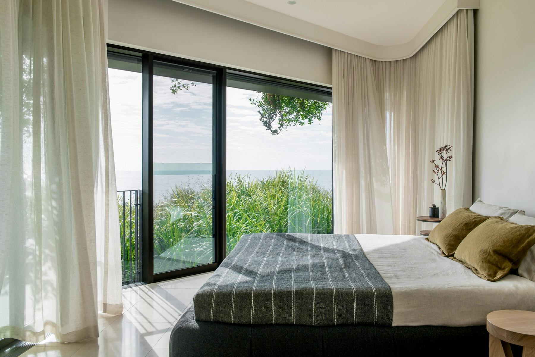 Ocean-view bedroom designed for rest and rejuvenation