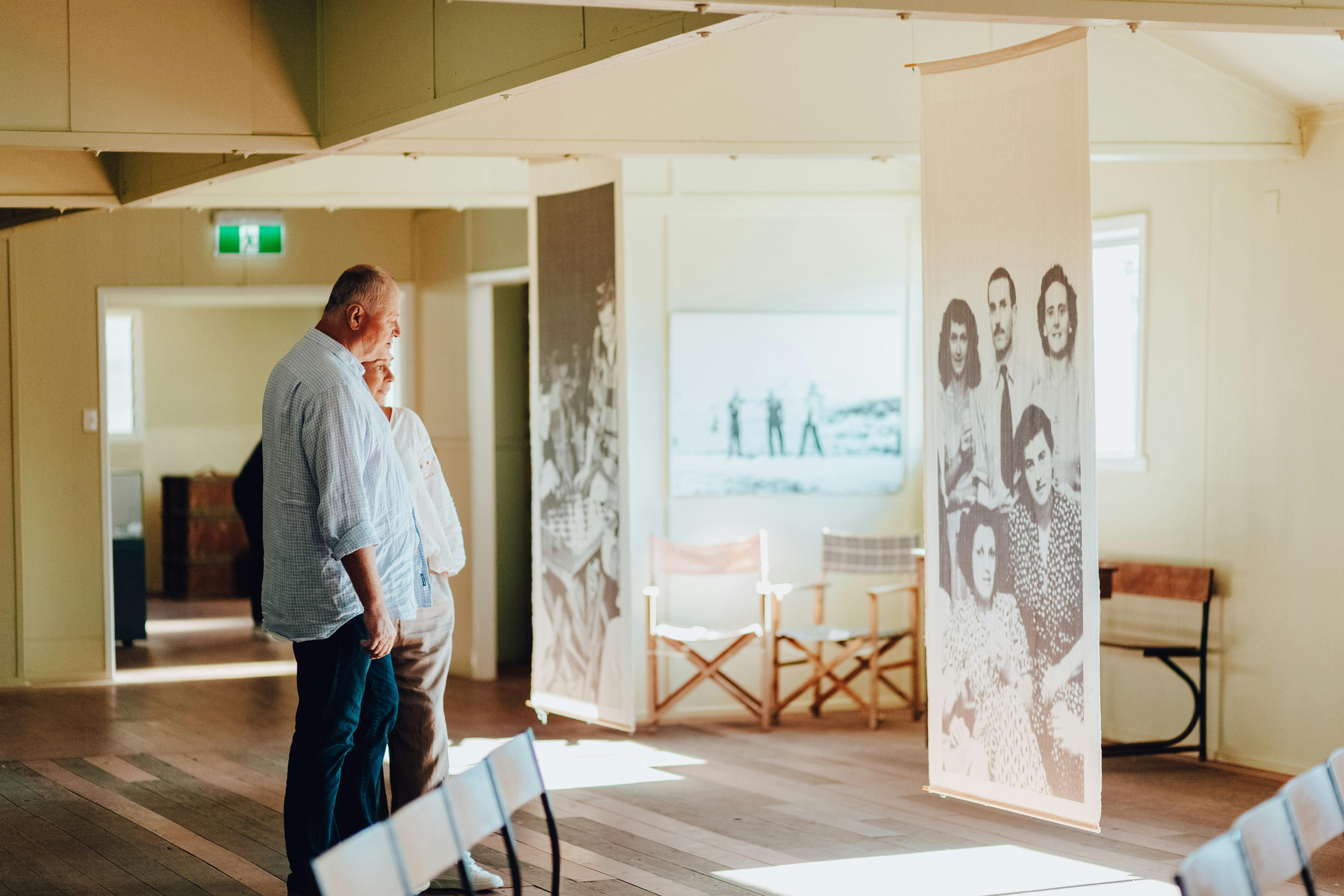 two people looking at a sign at the Bonegilla Migrant Experience