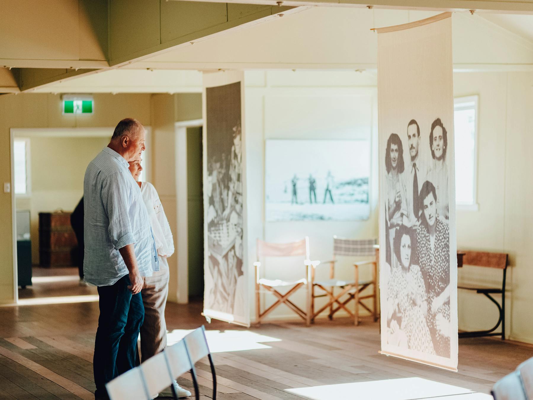 two people looking at a sign at the Bonegilla Migrant Experience