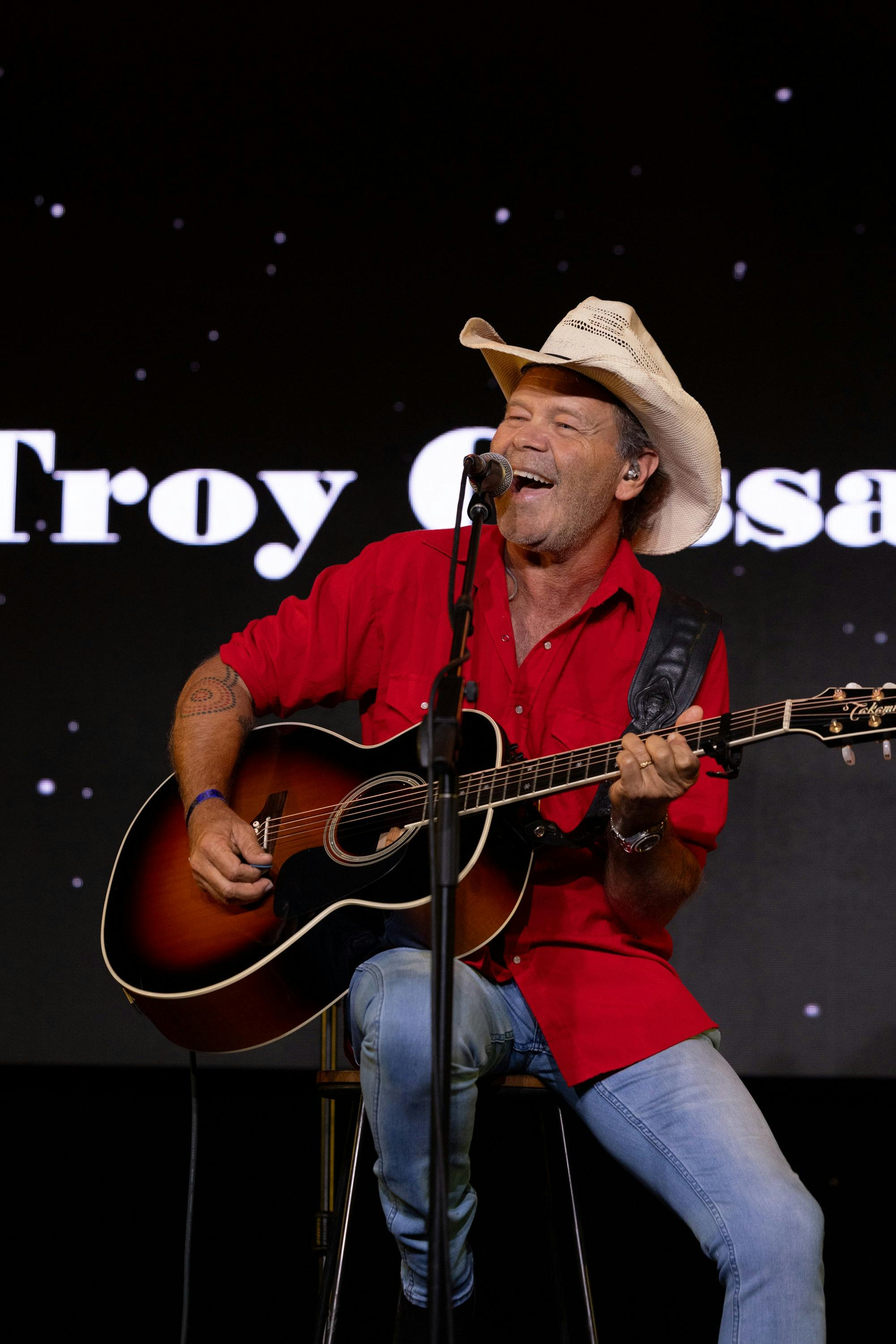 picture of a (Troy Cassar Daley) singer performing on stage