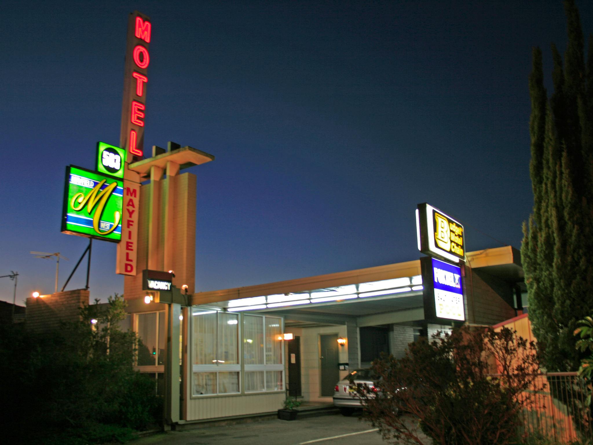 Mayfield Motel front entrance and classic neon signs at night