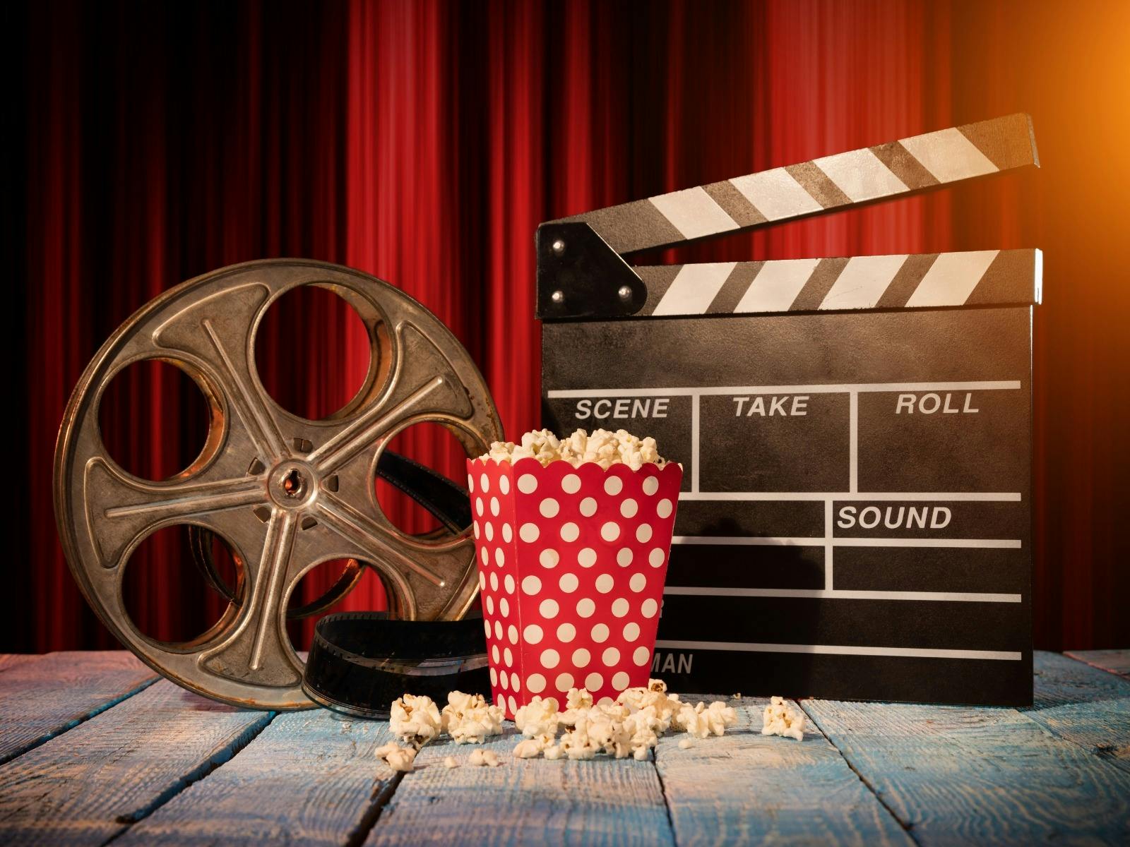 film reel, popcorn and clapperboard