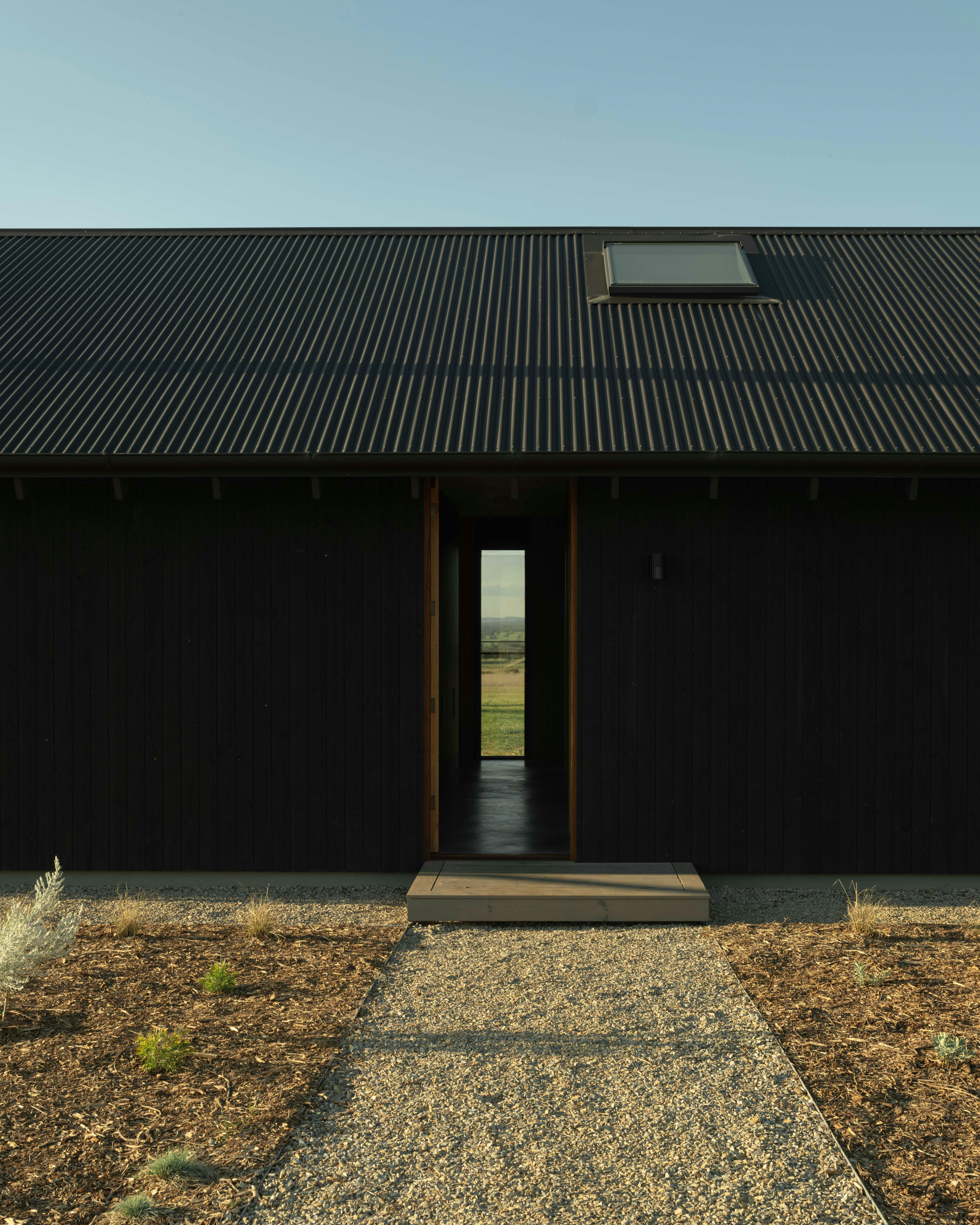 Front door open showing view to the other side