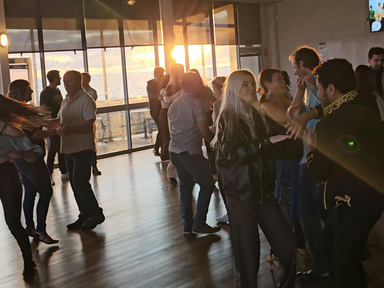 dance goers taking a dance workshop at Sunset Bahcata runned by Amor Latin Dance Studio
