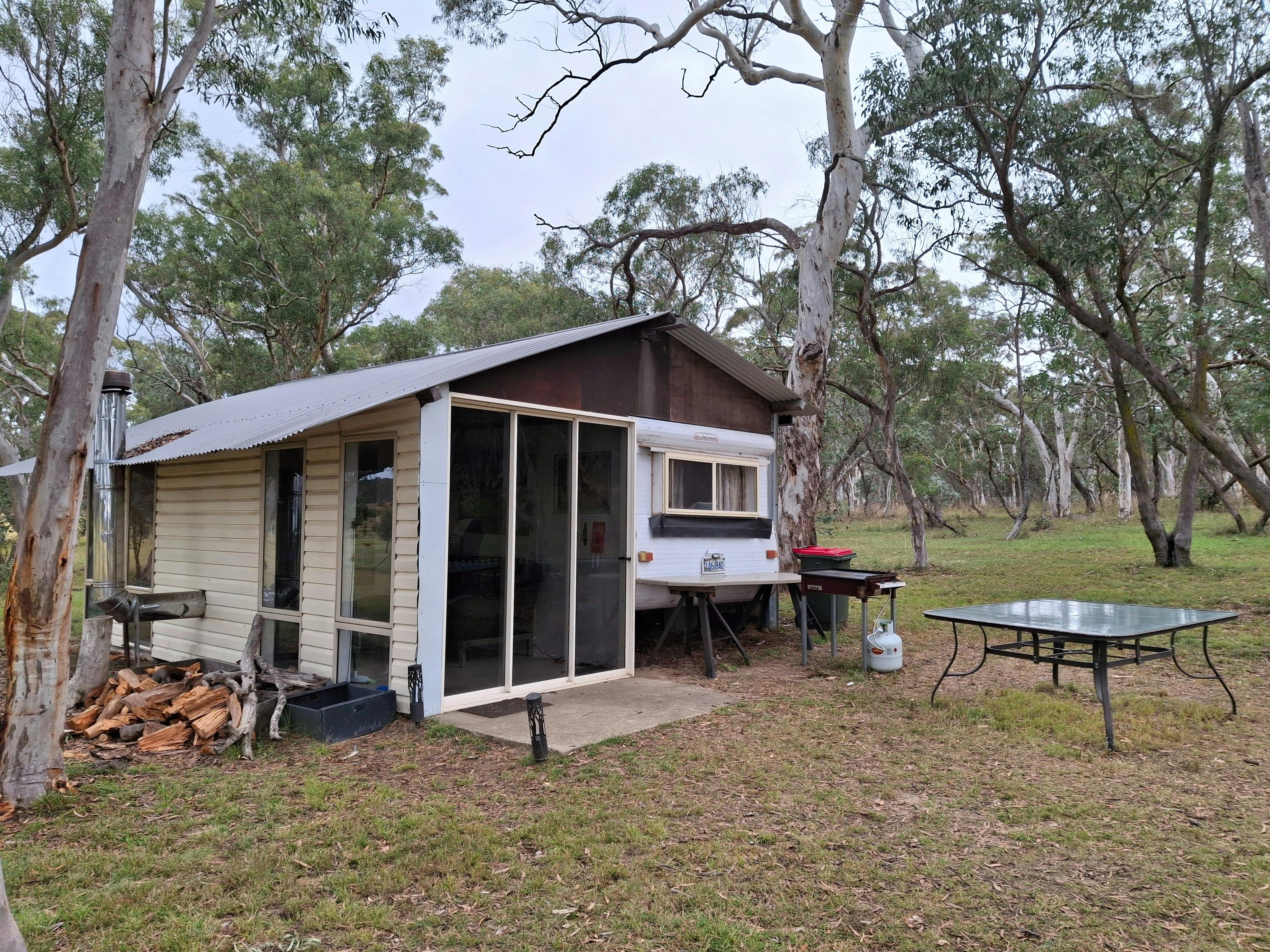Caravan with annex set amongst the gum trees