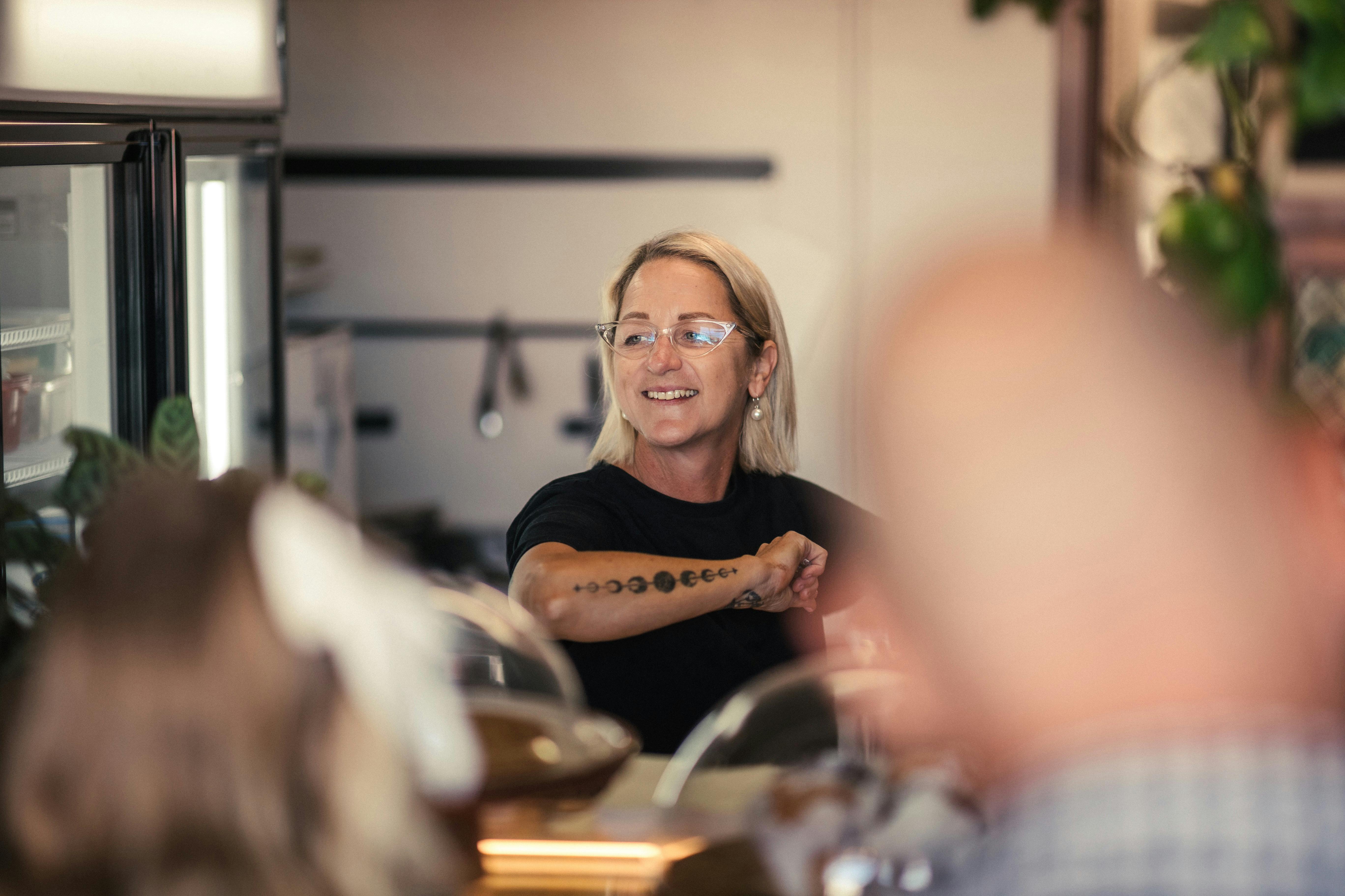 Cafe owner taking coffee order