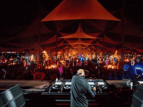 DJ Little Fritter playing at night to a large crowd