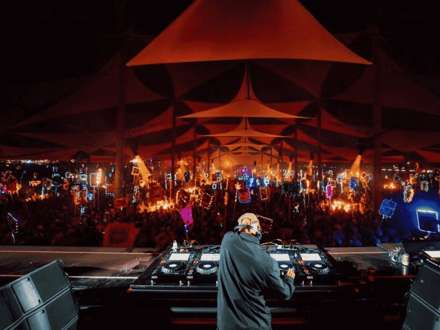 DJ Little Fritter playing at night to a large crowd