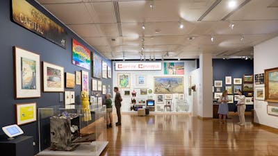 Exhibition image featuring people exploring the Canberra/Kamberri Exhibition
