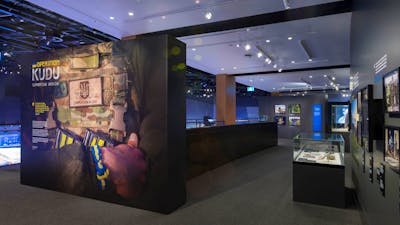 entrance to the gallery with main photo of solider with arms crossed
