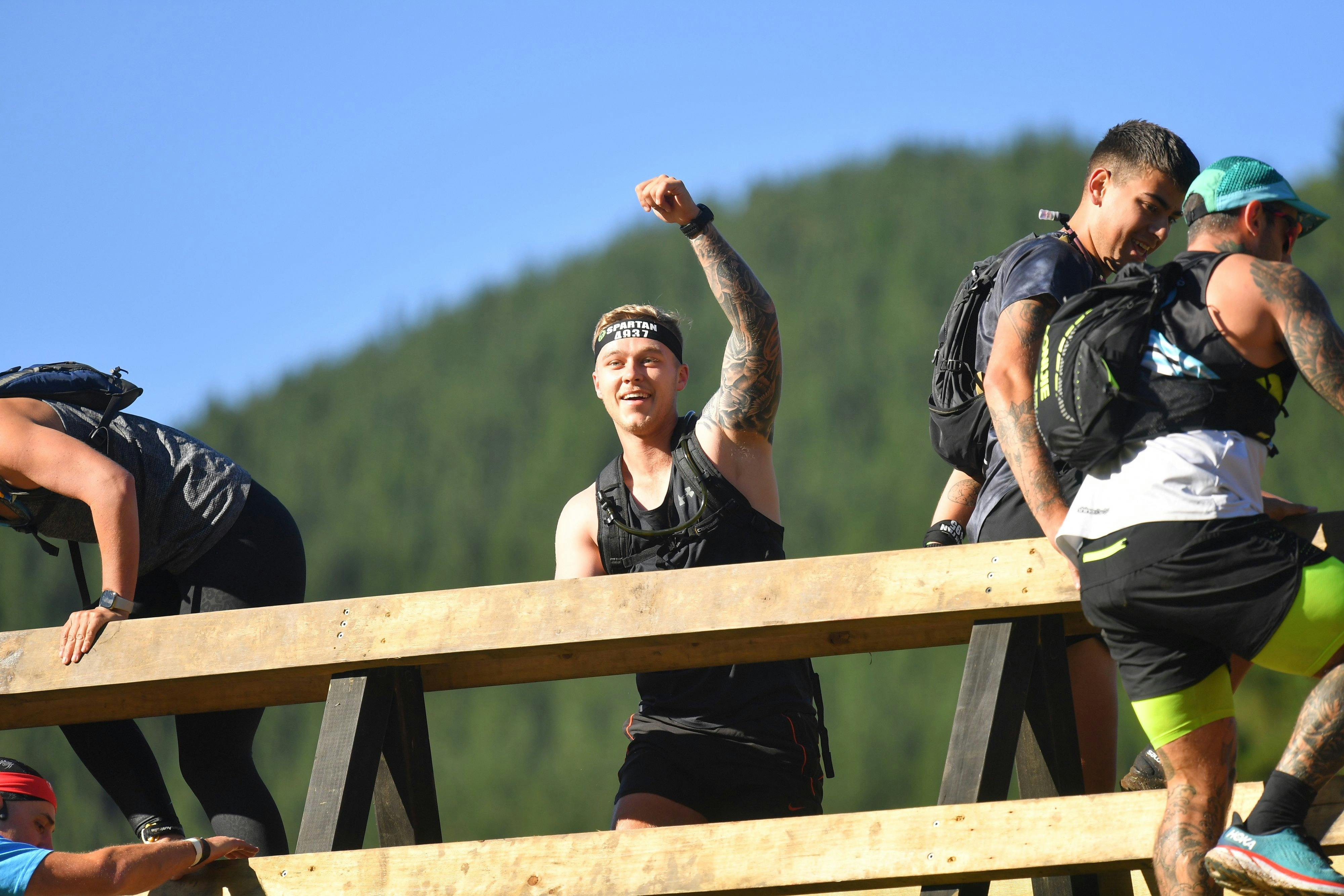 A person competes in Spartan Race.