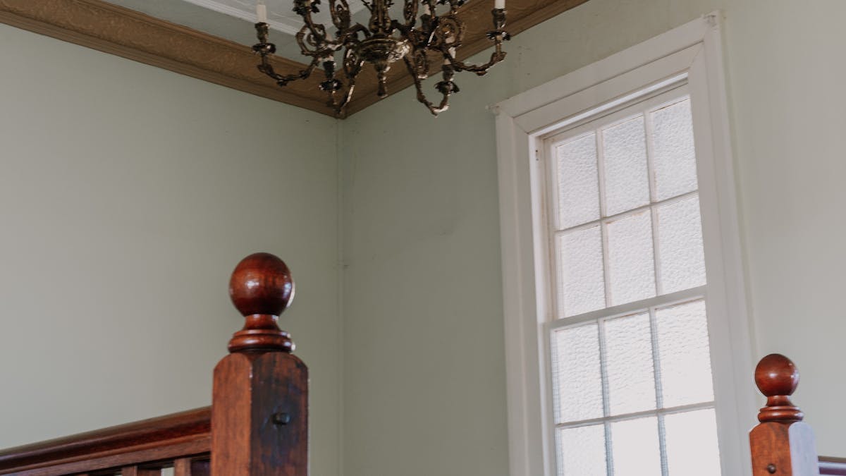 Beautiful vintage chandelier over staircase