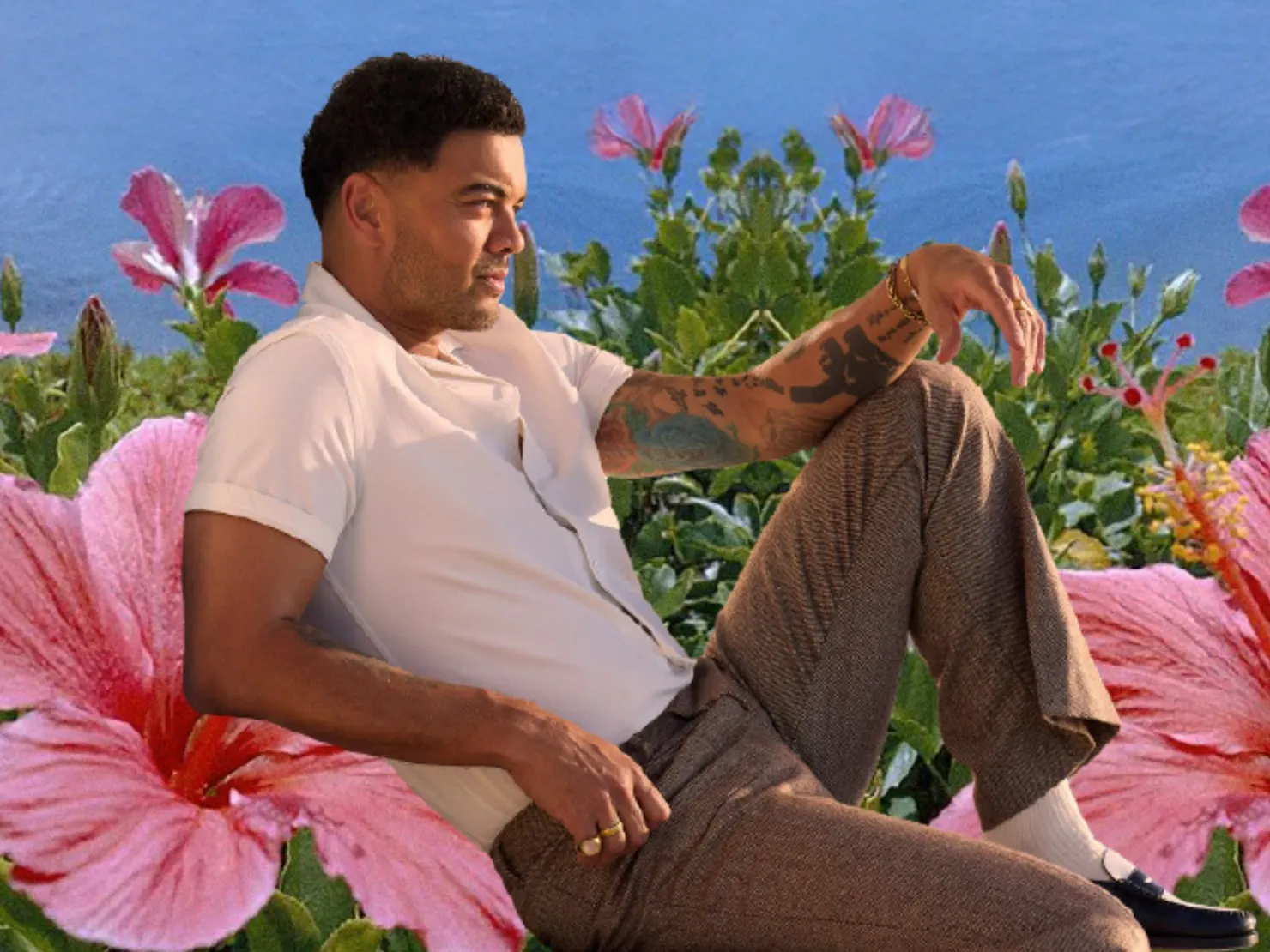 Guy sitting on a Hibicus flower