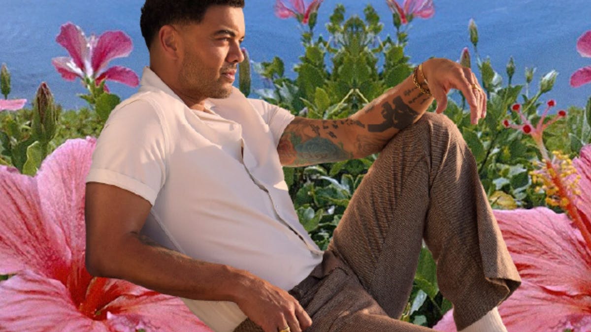 Guy sitting on a Hibicus flower