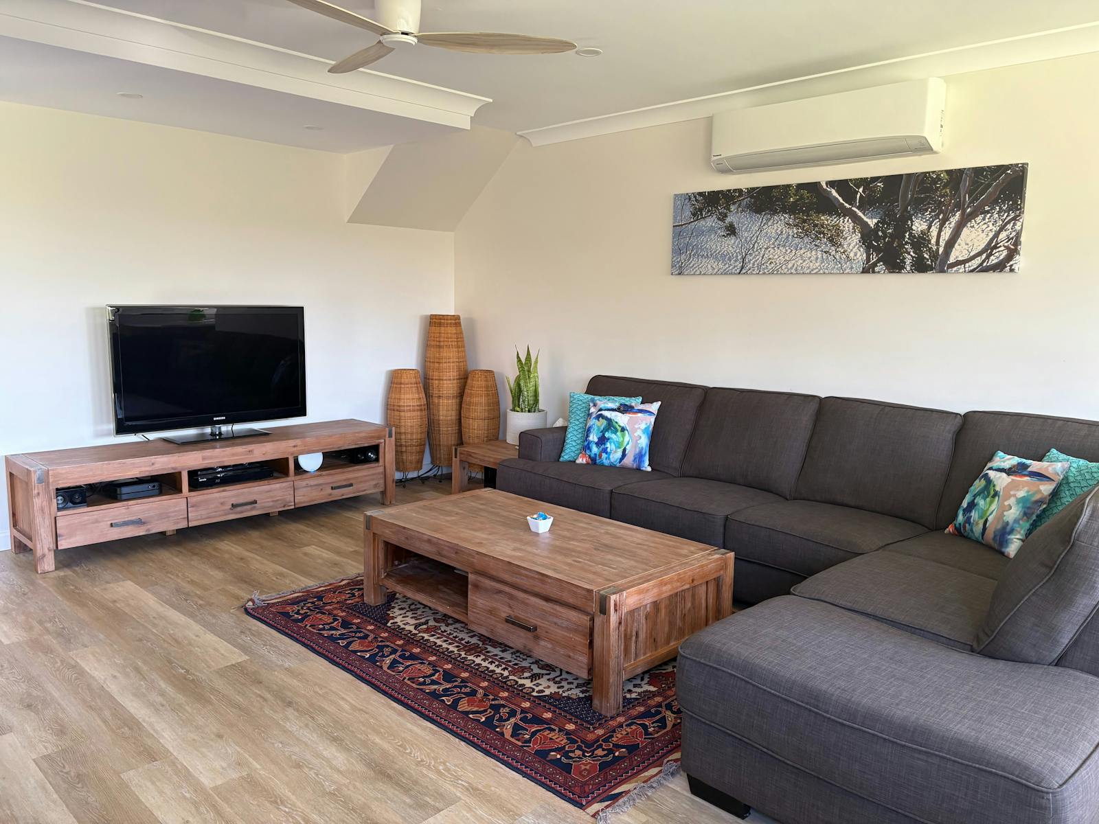 Lounge Room with comfortable lounge, TV, A/C