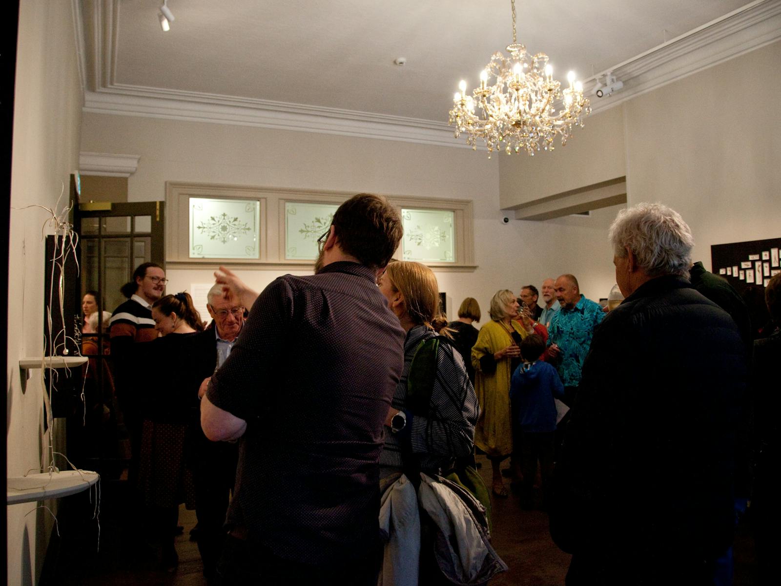 Crowd in the Howard Hadley Gallery for Silent Sentinels opening