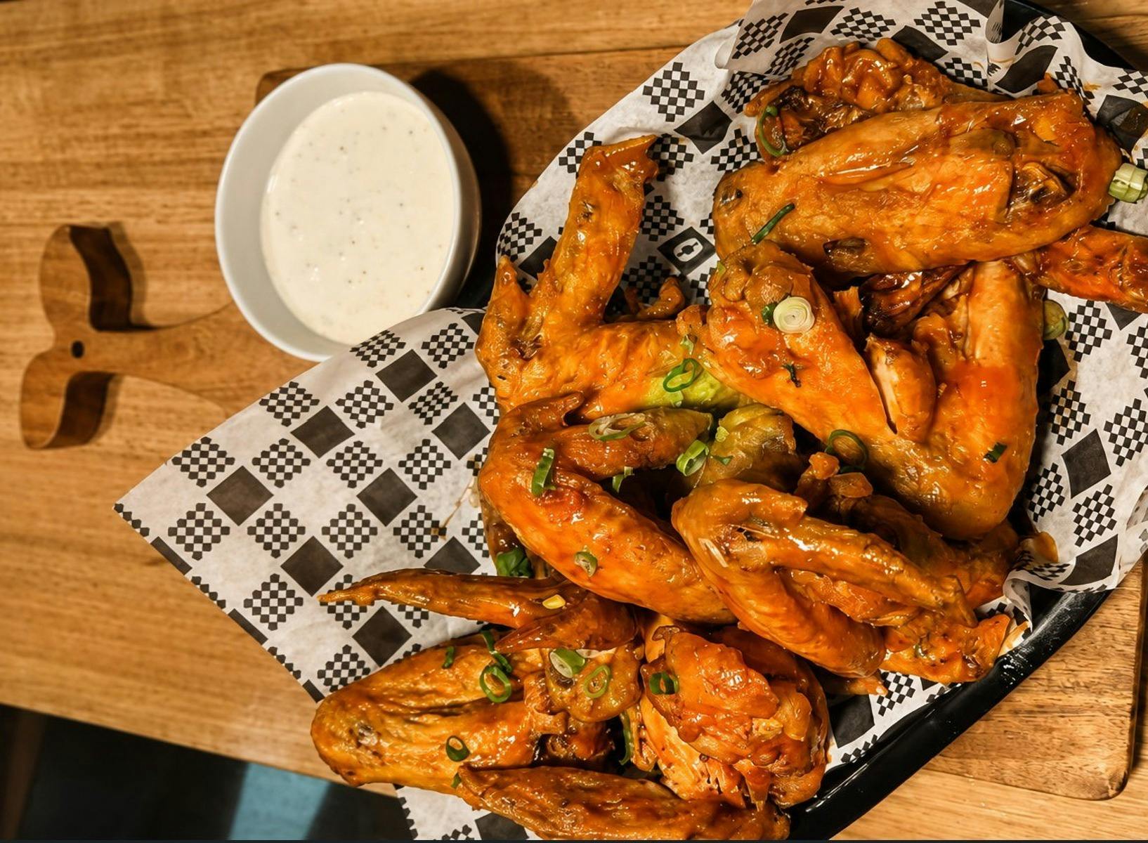 Our crispy chicken wings tossed in your choice of sauce and served with our dipping sauce.