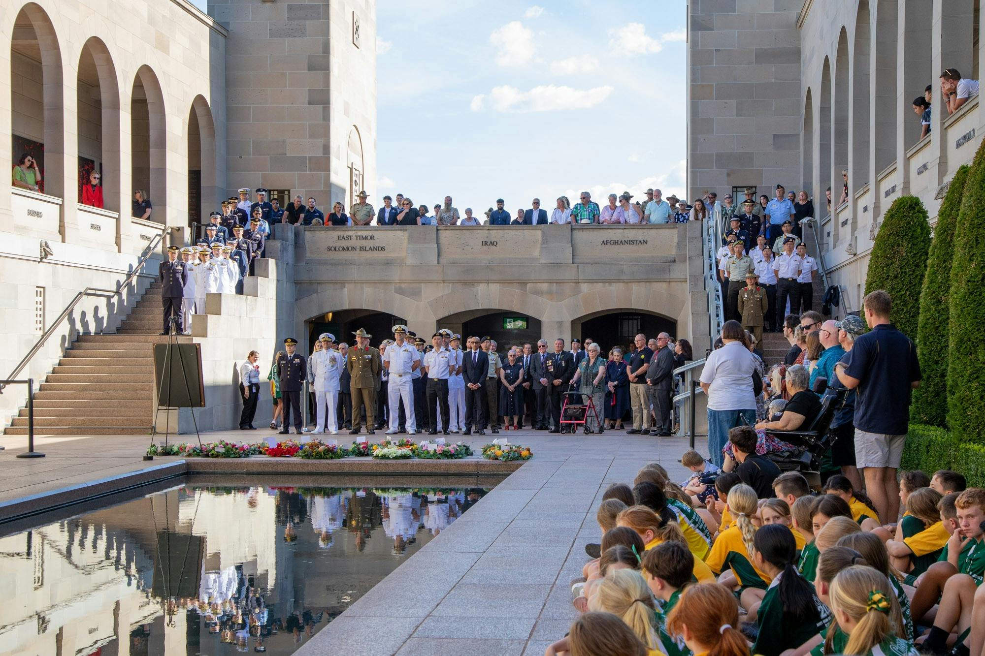 A large group of people attending the Last Post Ceremony at the Australian War Memorial