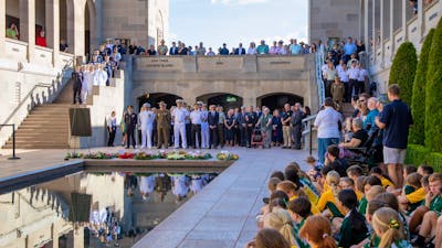 A large group of people attending the Last Post Ceremony at the Australian War Memorial