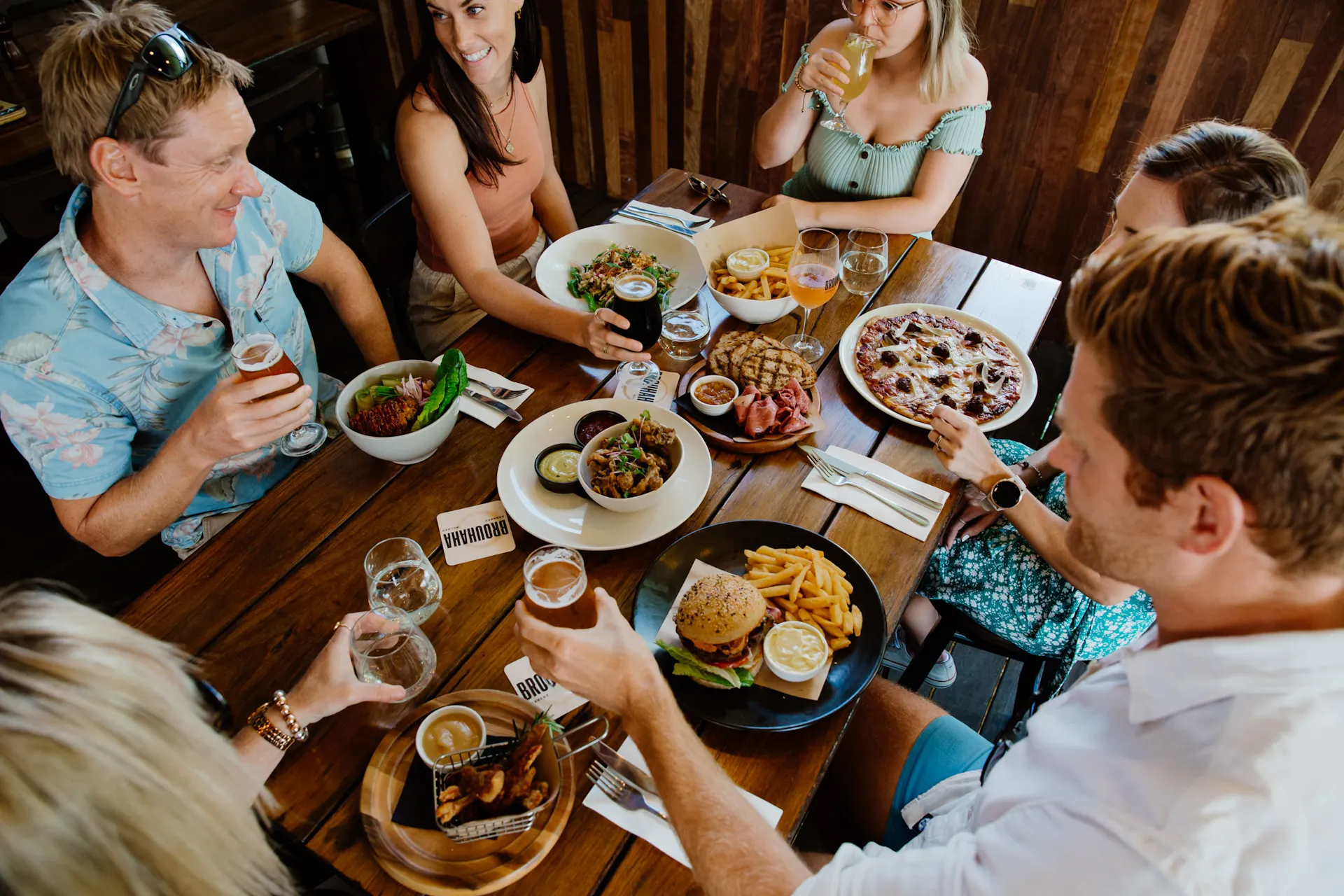 Brouhaha's outdoor table with food and customers