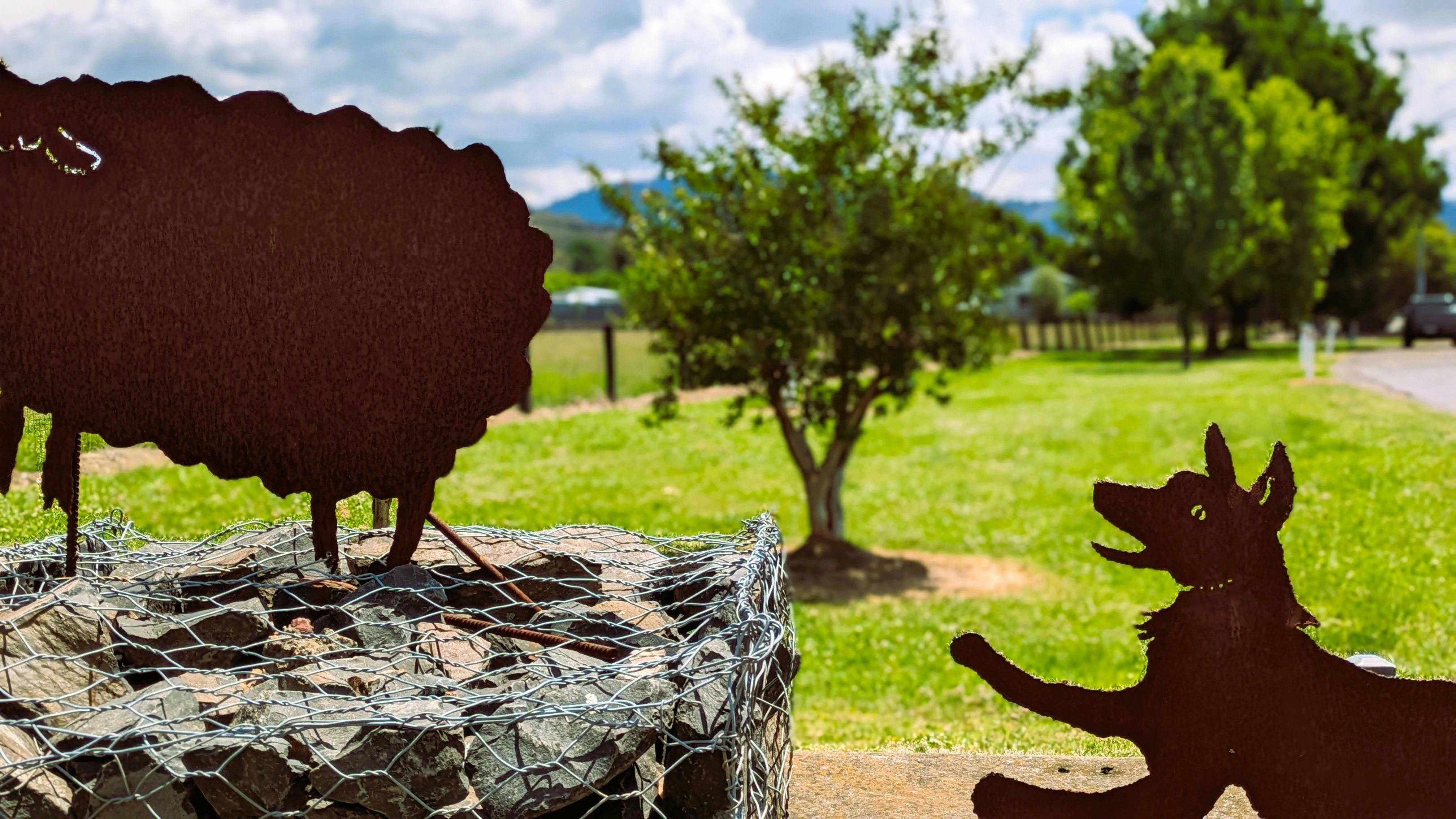 Murrurundi entry sculpture cattle dog chasing sheep
