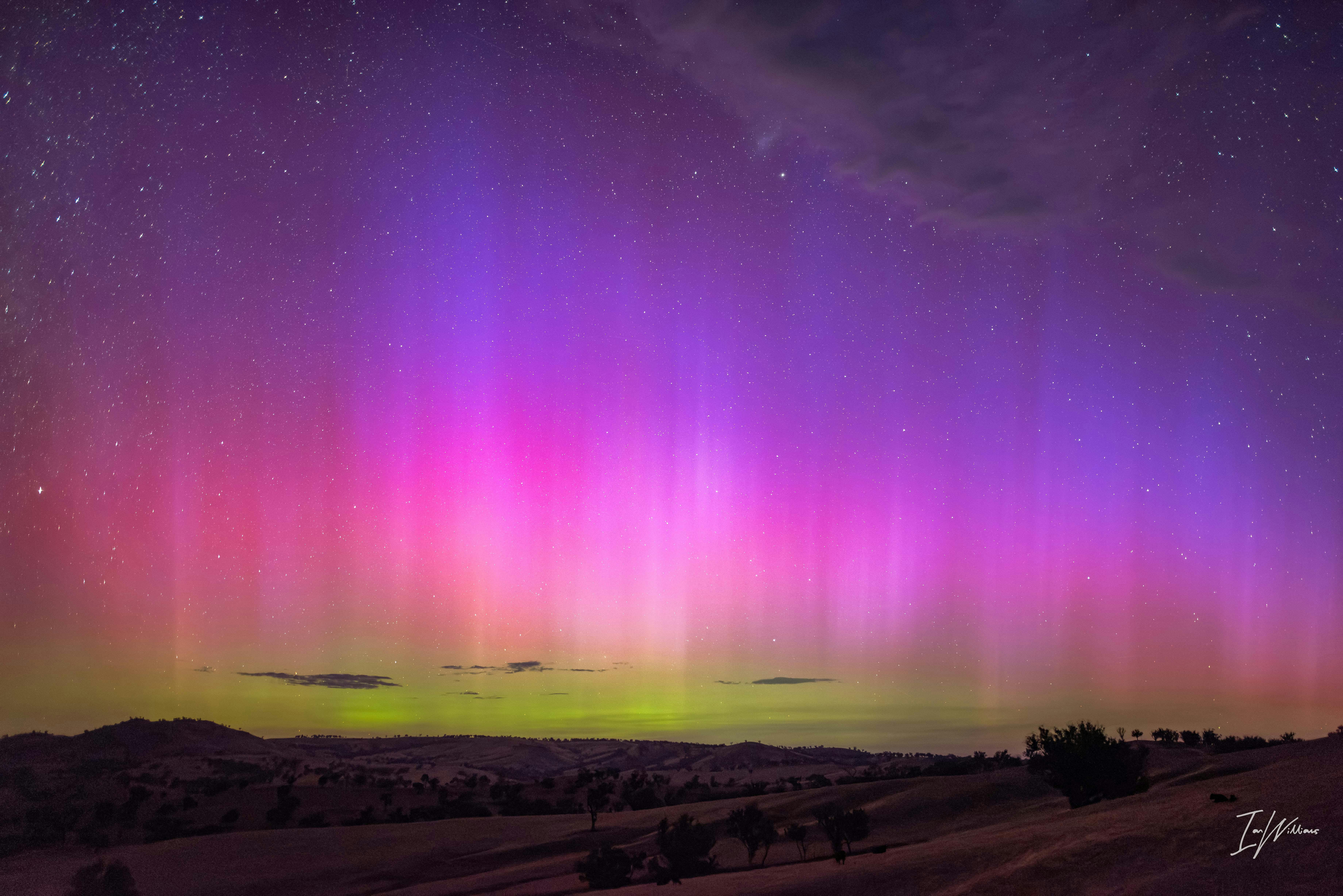 The yellows pinks and purple of a strong display of the Aurora Australis