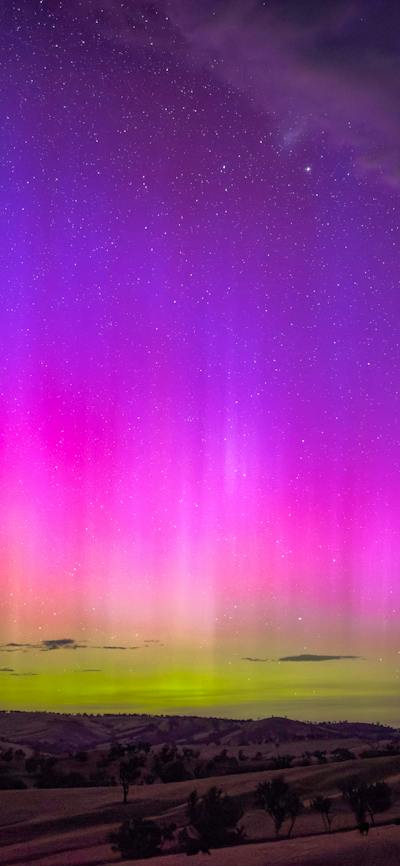 The yellows pinks and purple of a strong display of the Aurora Australis