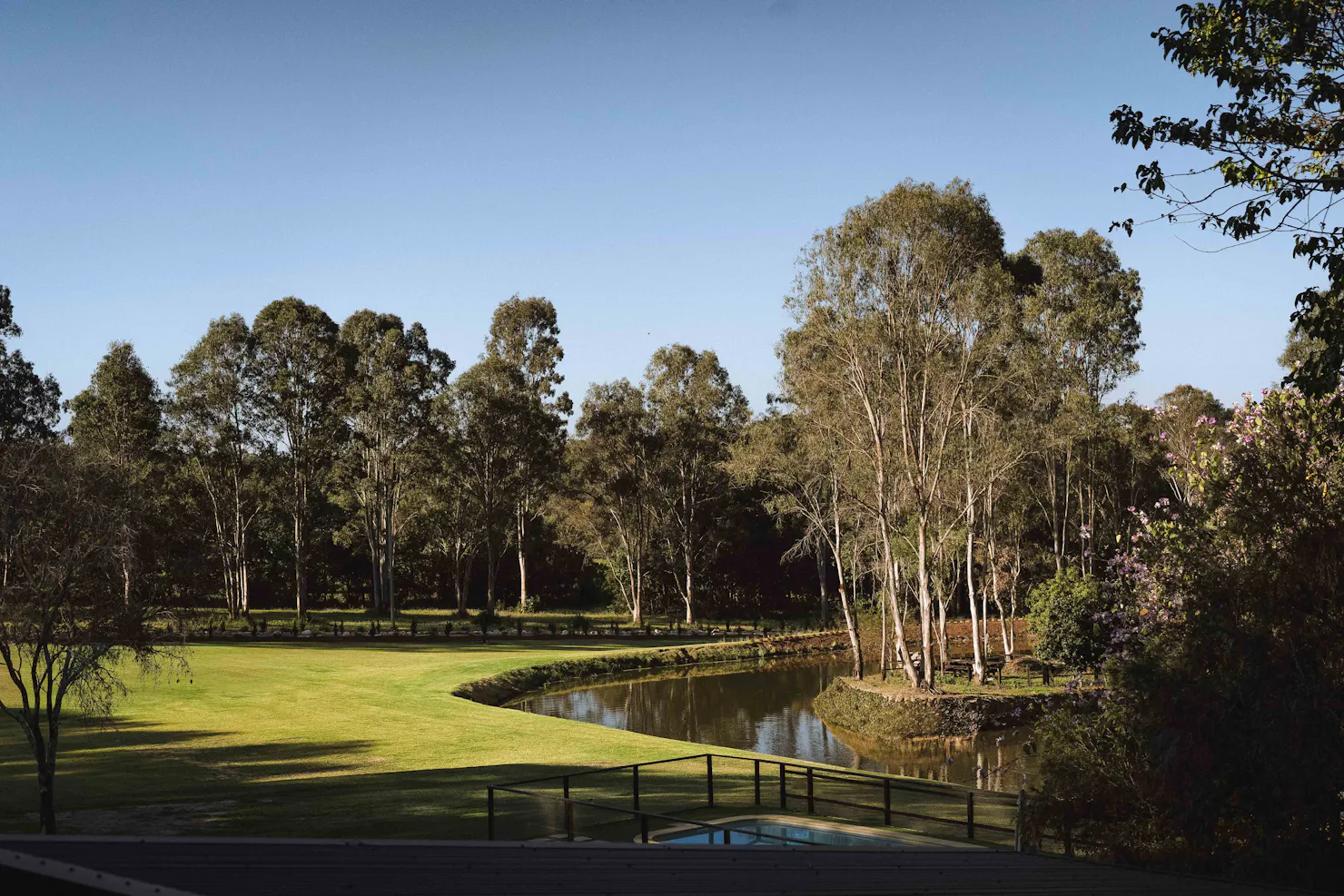 Pedicured lawns with large dam surrounded by gum trees