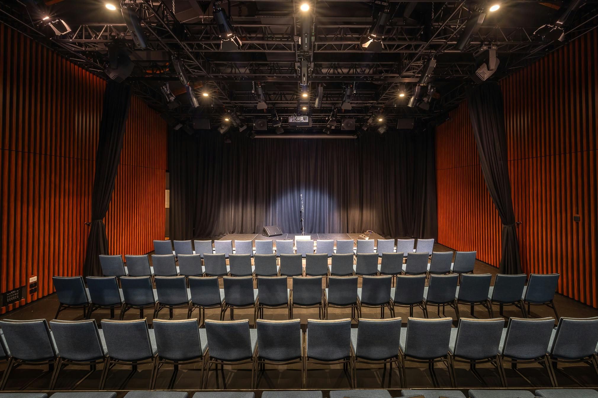 interior image of the theatre showing seats, stage and technical facilities
