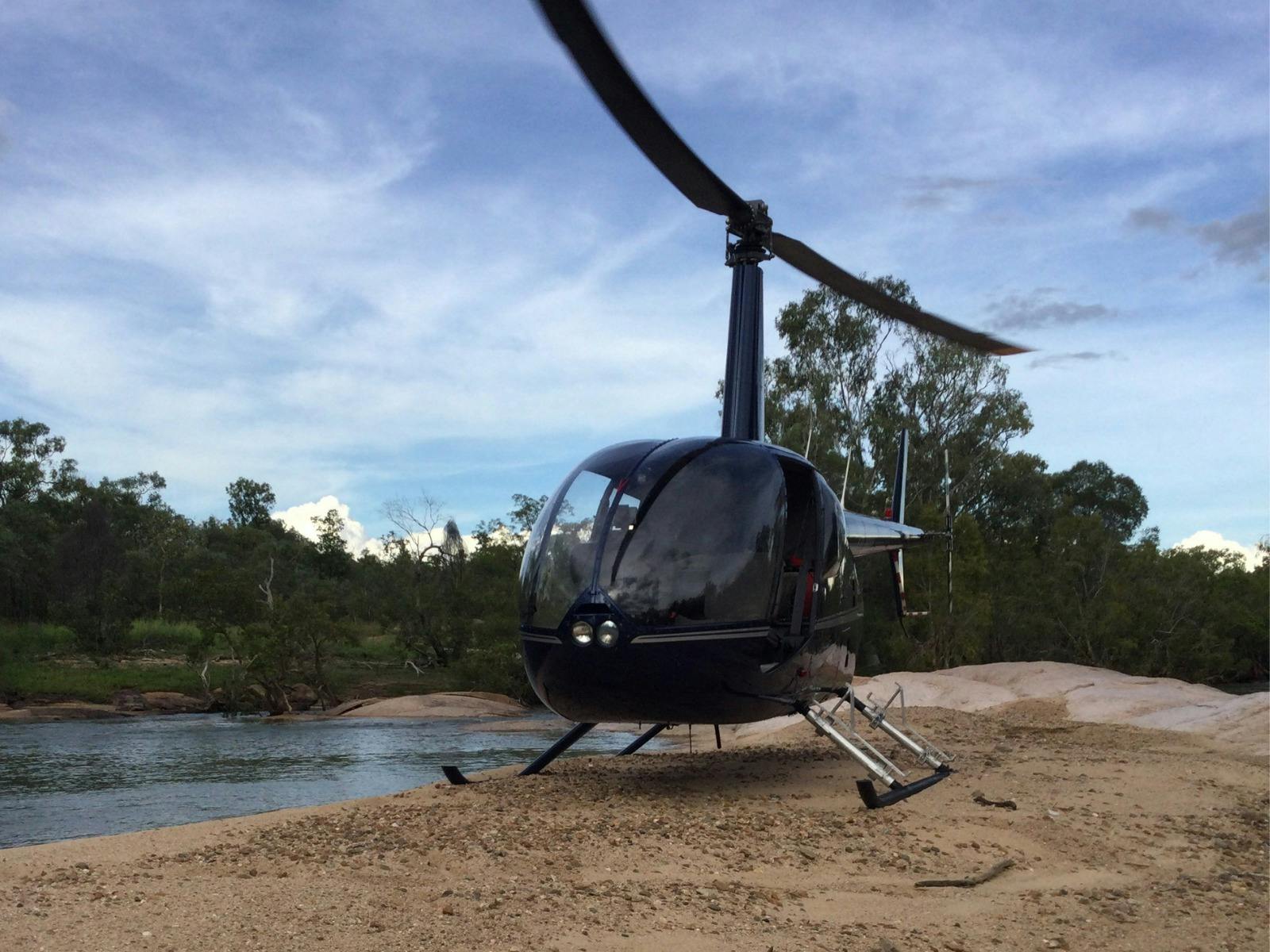 Robinson R44 Helicopter on the riverbank