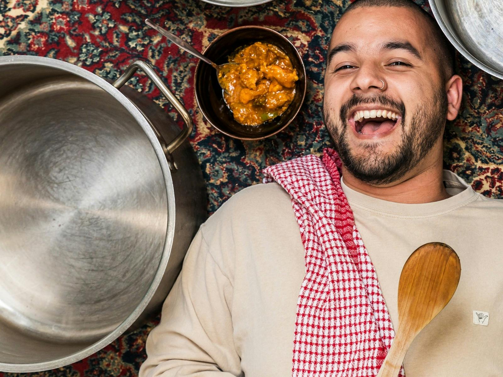 Josh Hinton with his nan's famous chicken curry that audiences can try after the show