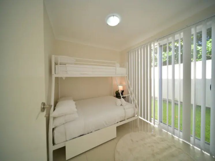 2nd bedroom with bunk style bed, double bed with single on top
