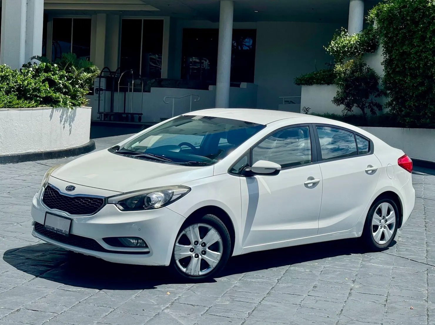 RentaCar Noosa White Kia sedan delivered to Elysium Noosa