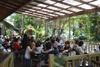 Their tropical deck busy with rustic artifacts hanging.