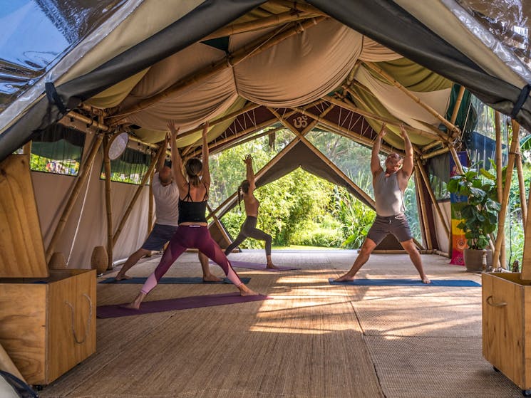 Students practicing yoga at Bamboo Yoga School, Byron Bay