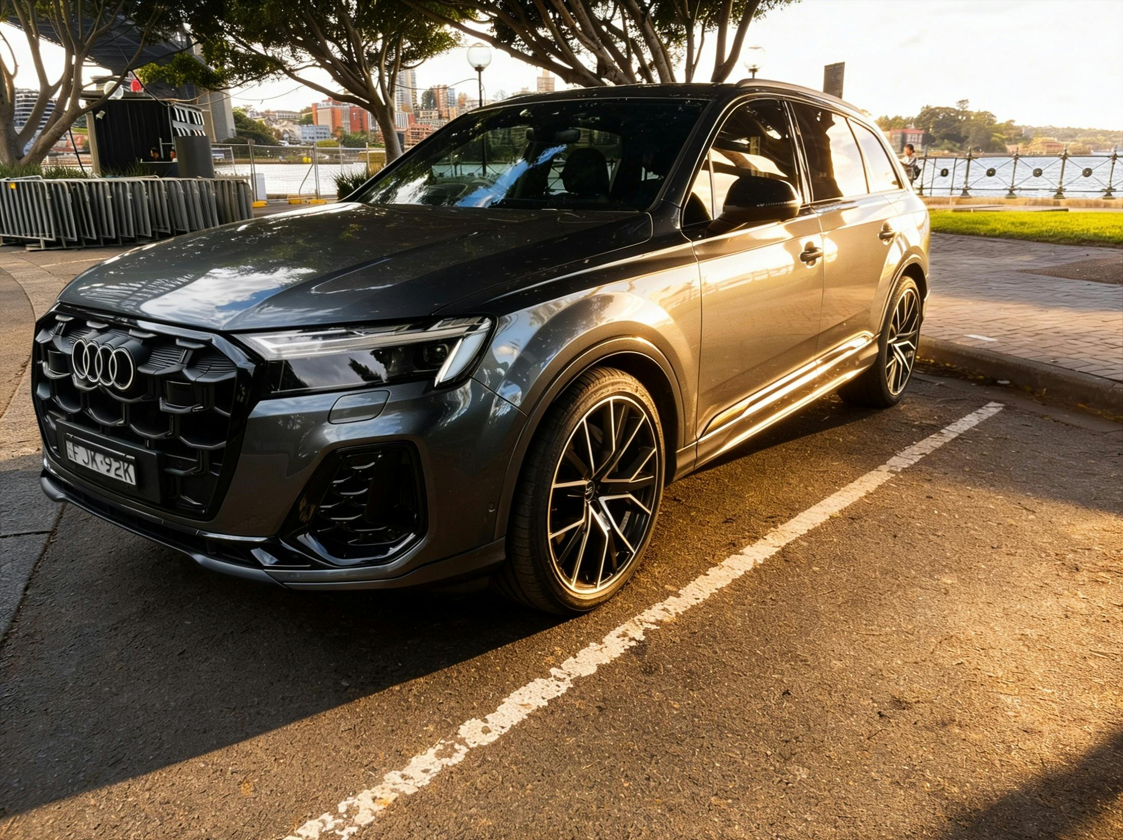 The First Chauffeurs Audi Q7 luxury SUV at Sydney waterfront — premium chauffeur service NSW