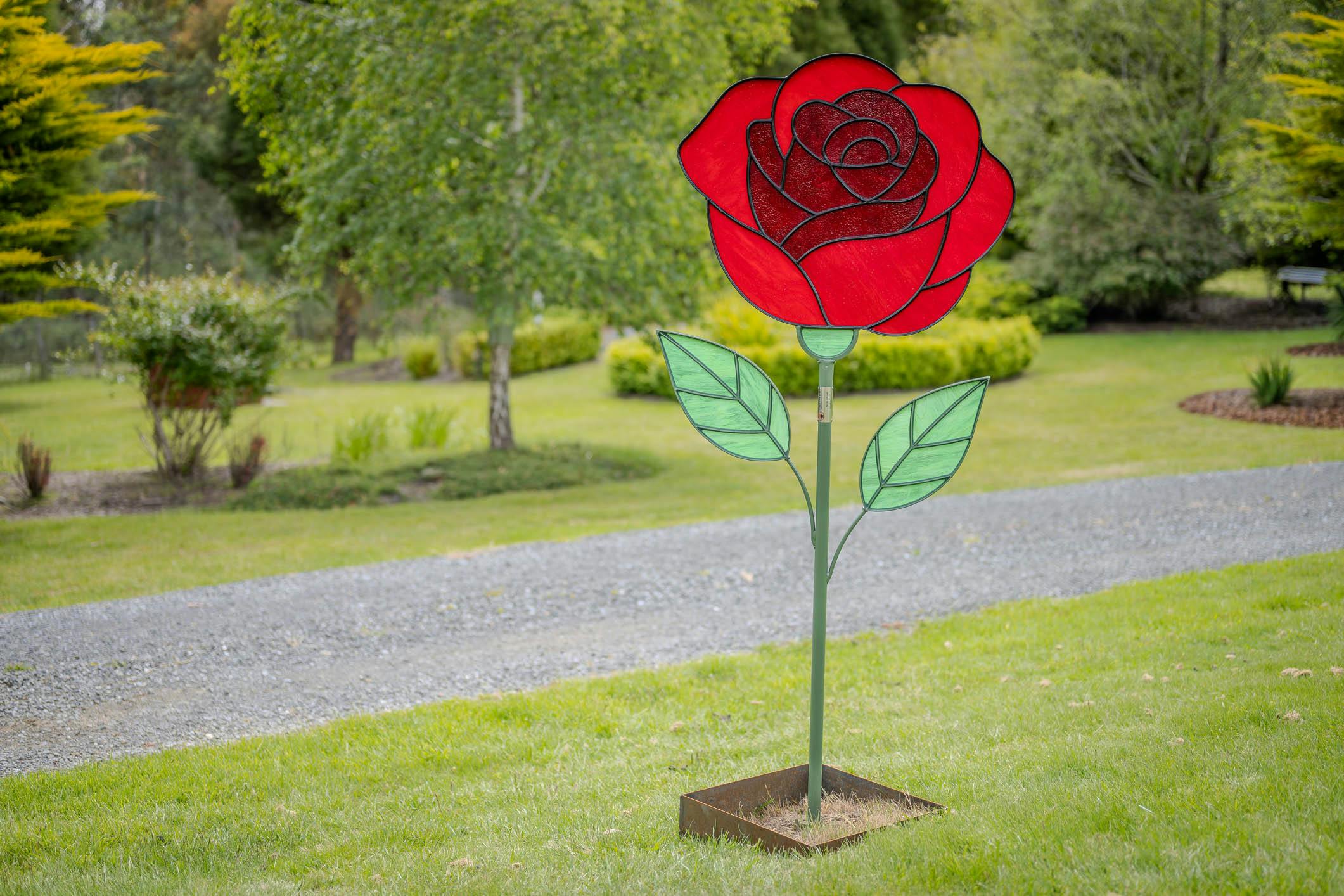 Handmade steel and stained glass red rose garden sculpture.