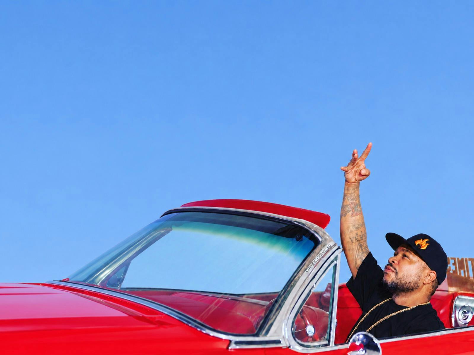 Xzibit hand up in car