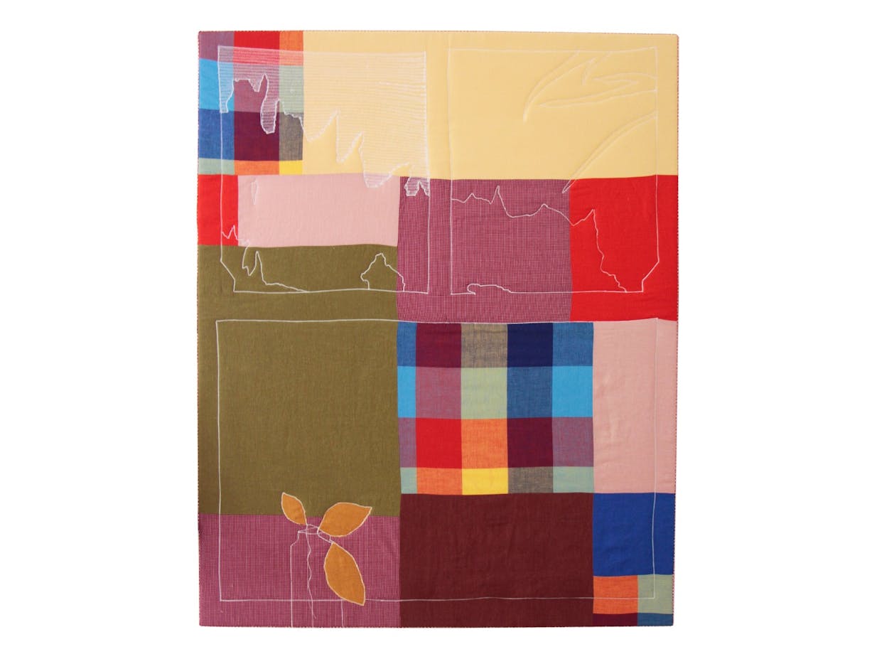 Rectangle patchwork textile artwork with blue, yellow, red and green colours as well as thread.