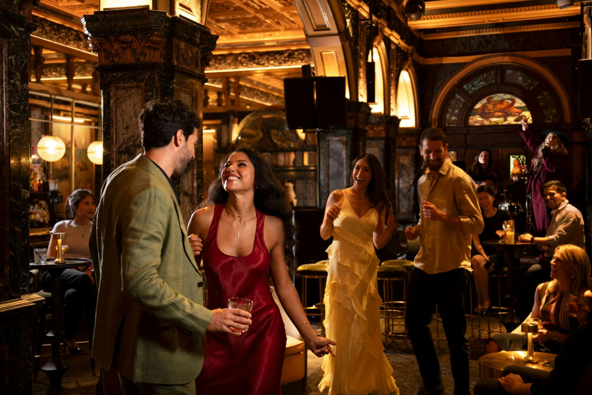 A group of friends dancing at Marble Bar, located at Hilton Sydney.