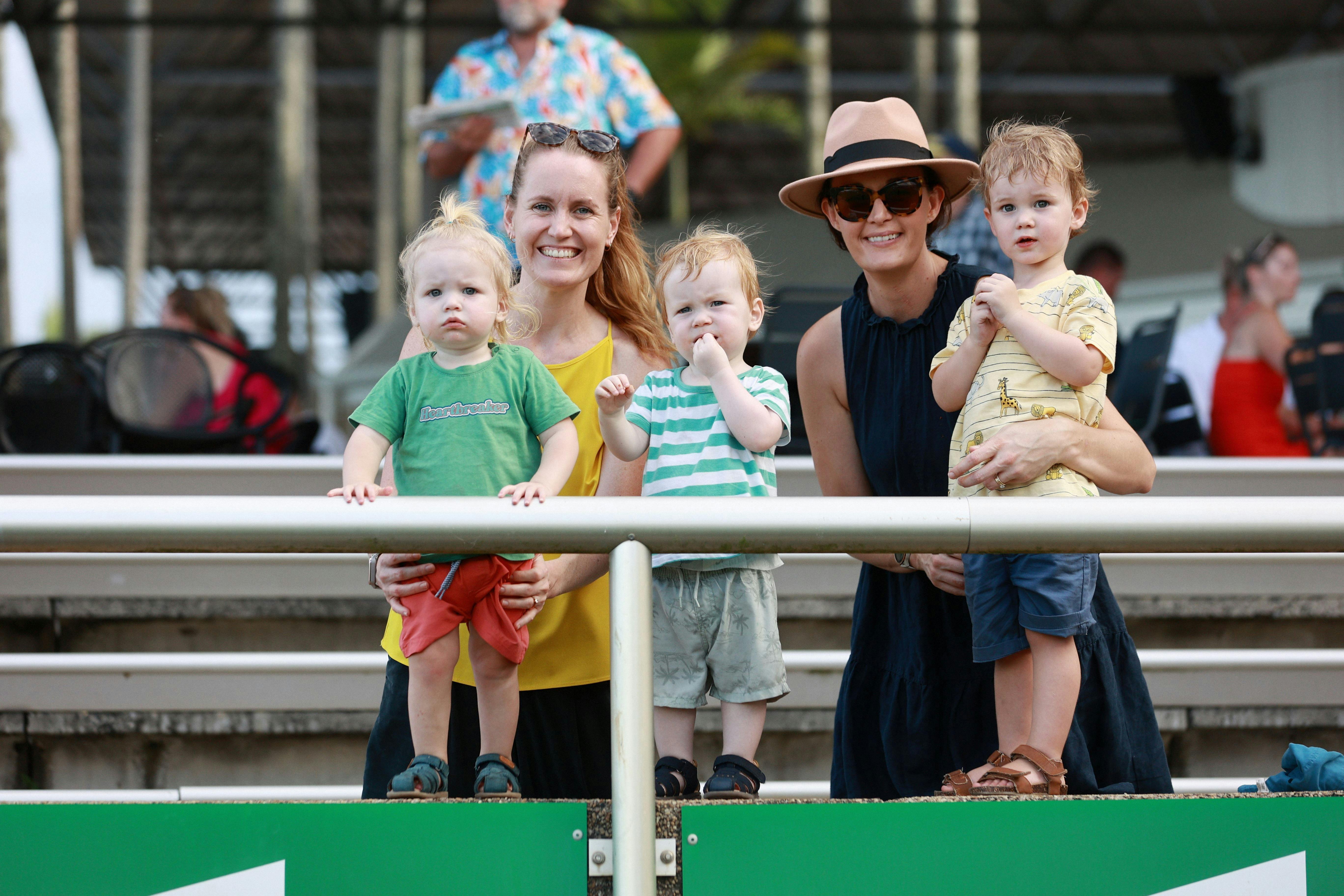 2 mums with their 3 kids smiling
