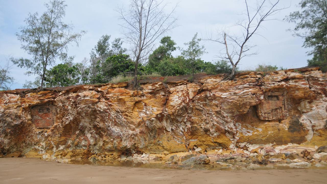 Two observation posts visible in the cliff face (right and left).