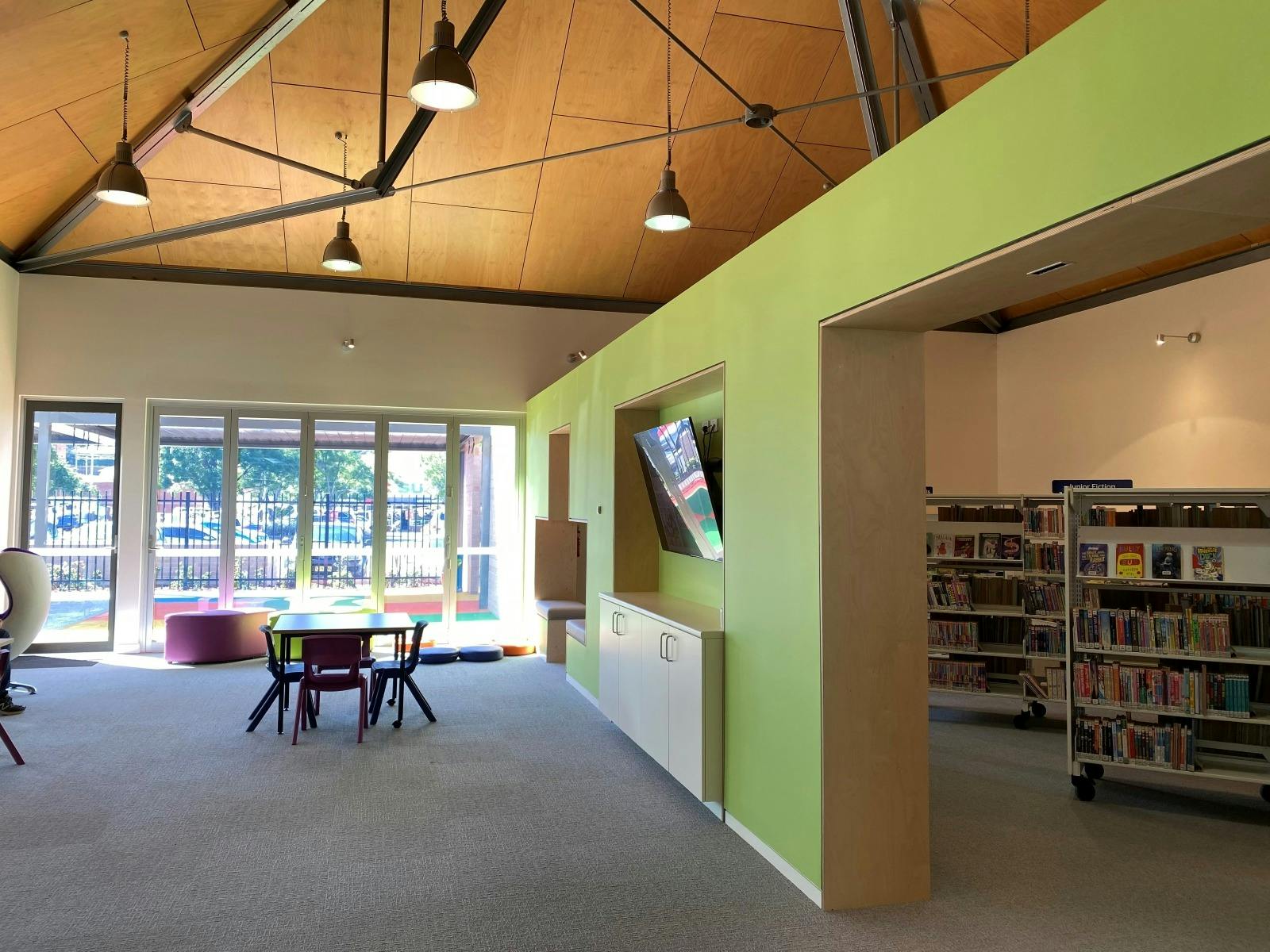 Inside the library. Books on Book shelves and and space to sit