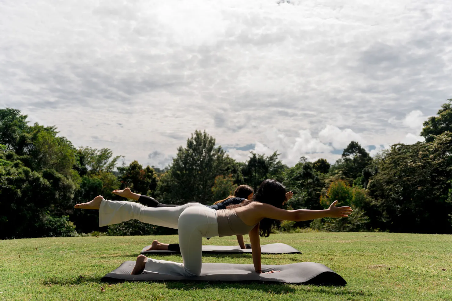 People doing yoga on the lawn