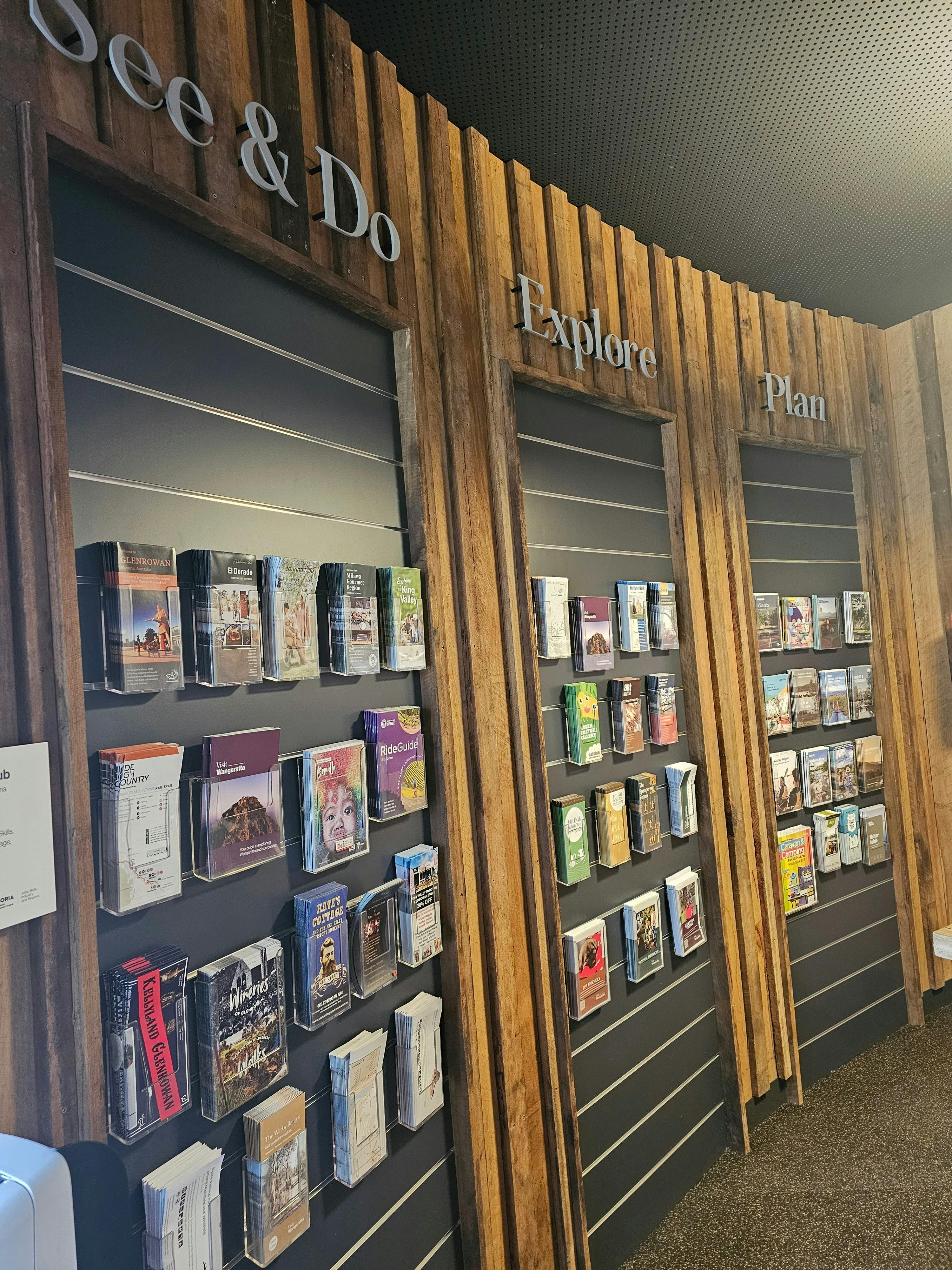 wooden slat walll with local regional location brochures.