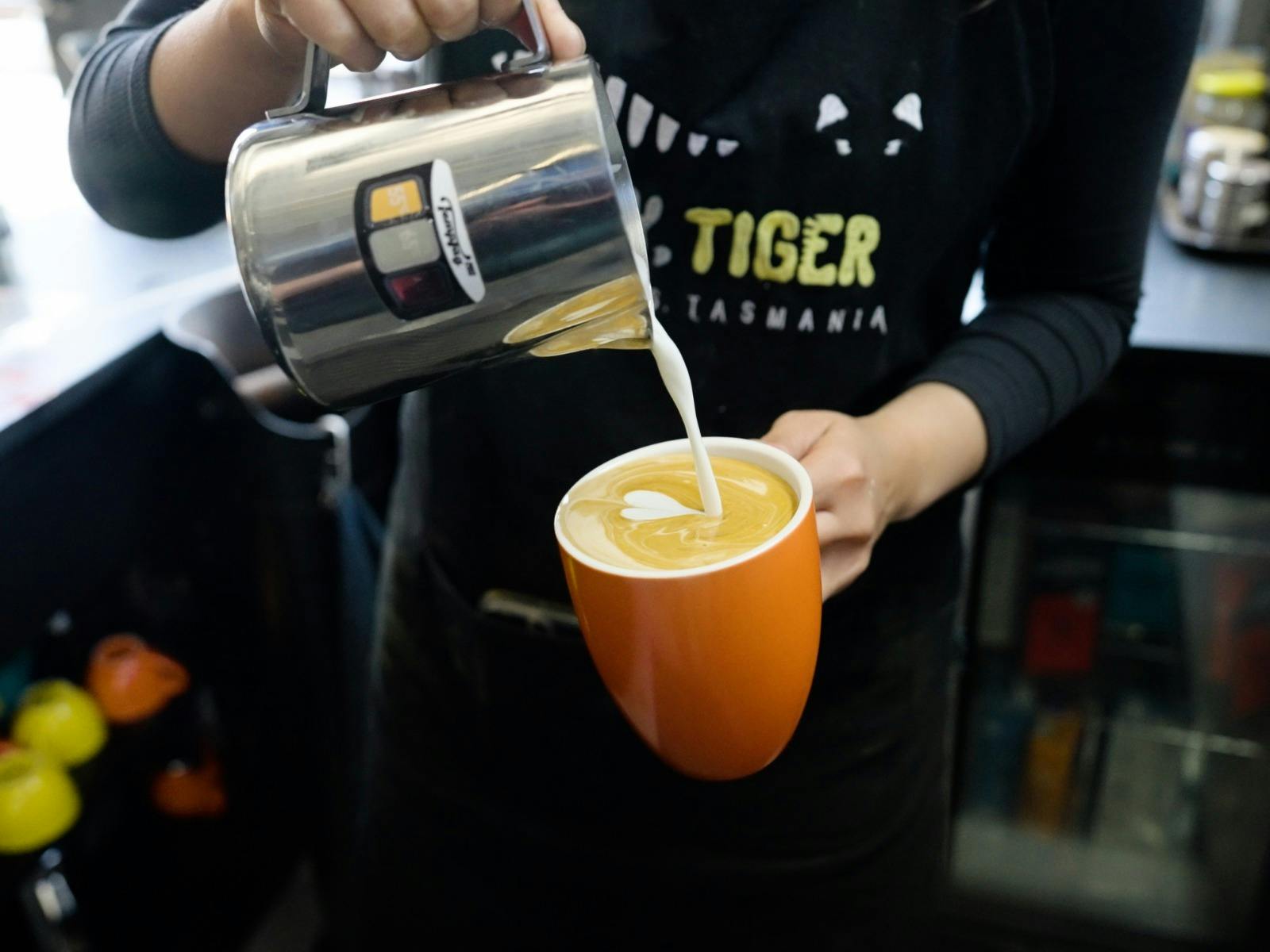 Barista making coffee at Easy Tiger in St Helens, Tasmania.