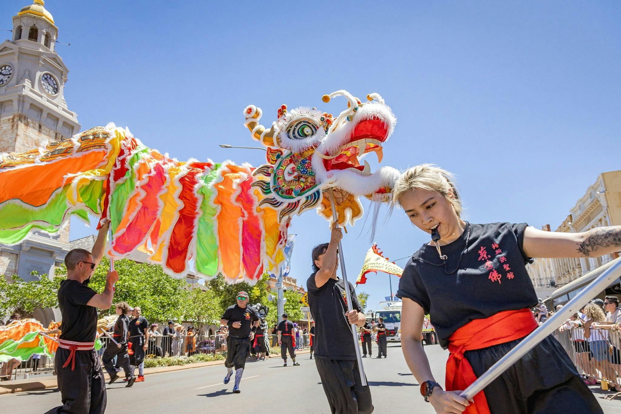 Street performers with a Chinese dragon in the St Barbs parade