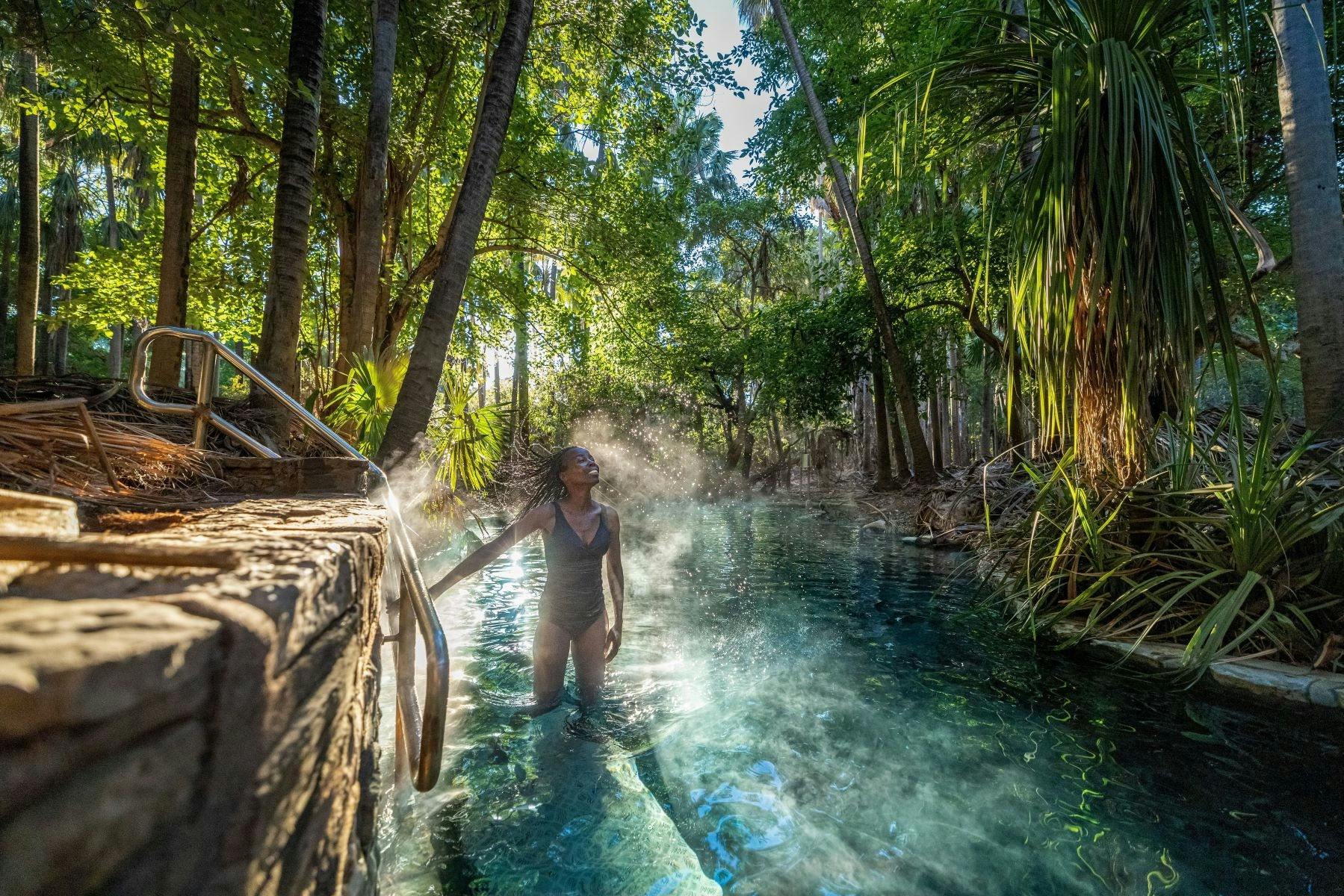A girl standing up and enjoying the Mataranka Hot Springs