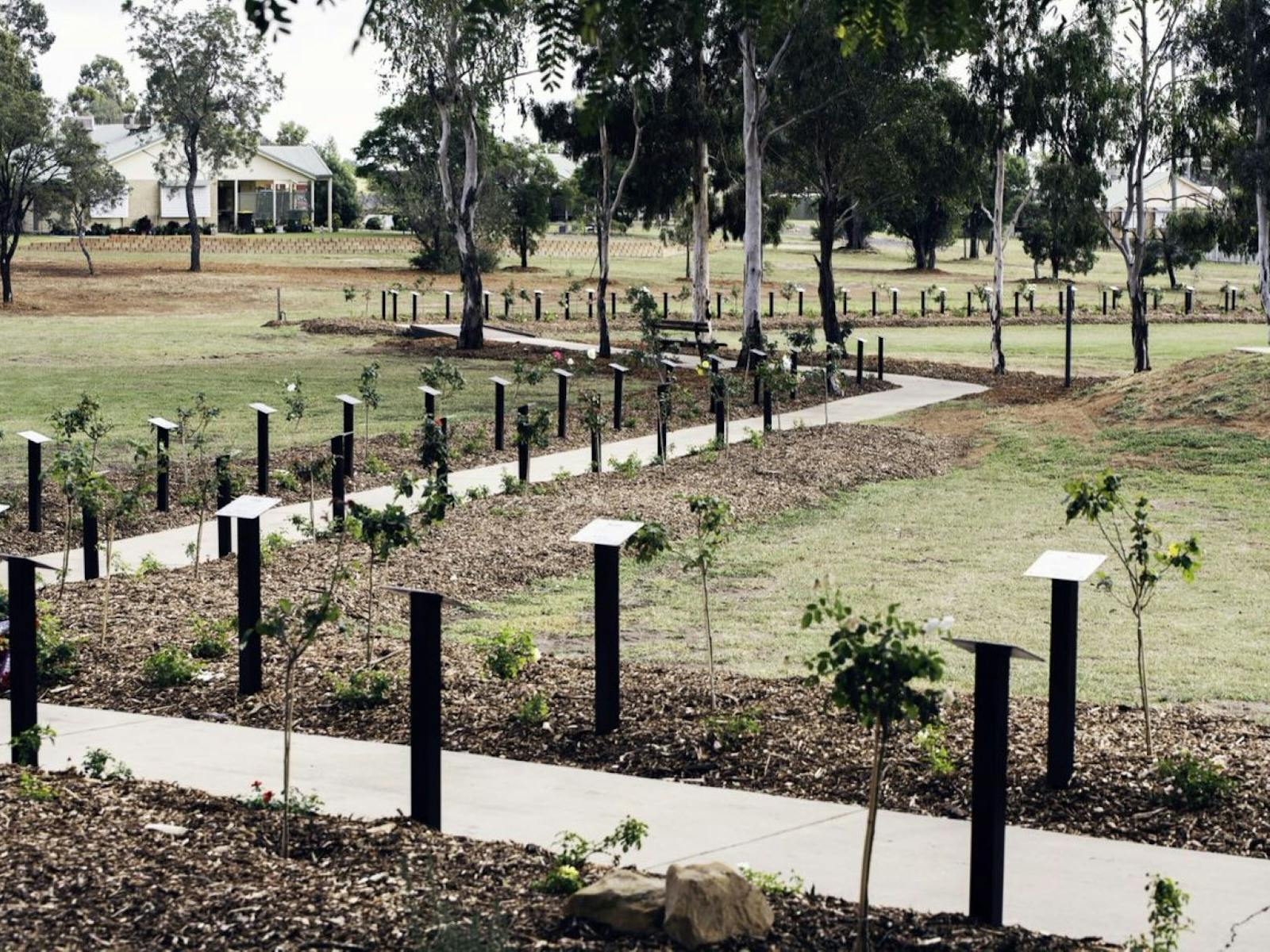 A winding path with plaques and rose bushes in memory of the early Wandoan soldier settlers.